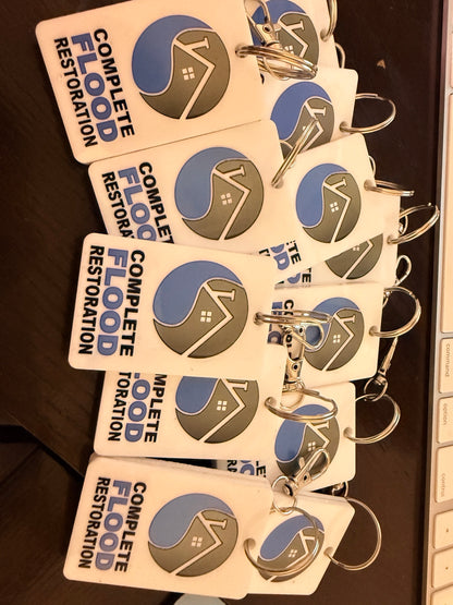 Bulk custom UV printed NFC keychains personalized with a full color business logo